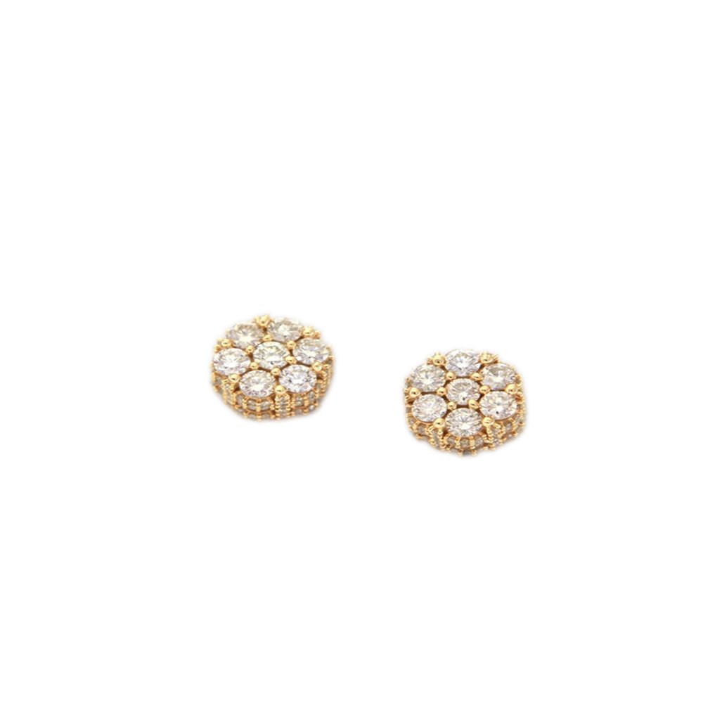 Pair of gold and diamond stud earrings with a circular design.