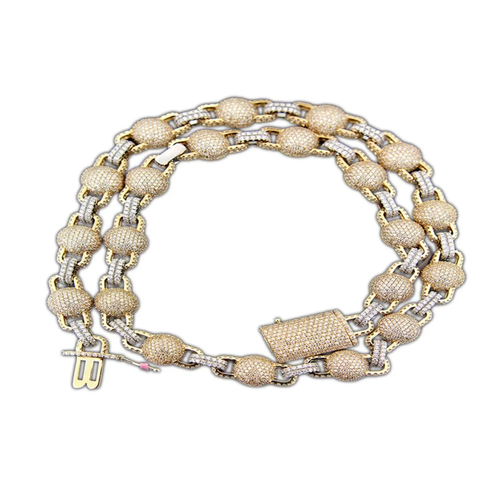 Gold and silver chain necklace with round beads, a rectangular clasp, and a pendant with the initials B and B.