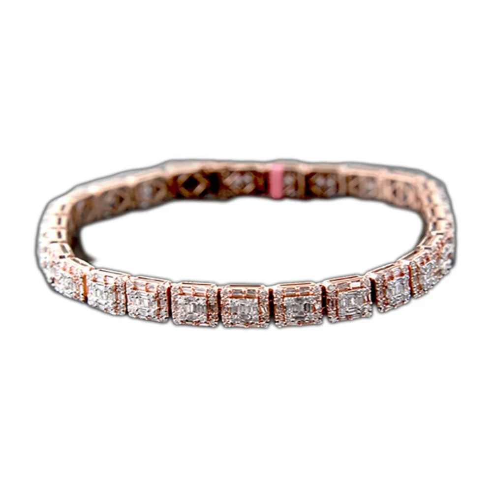 A diamond tennis bracelet with a gold and silver tone finish, featuring square-cut diamonds set in a row.