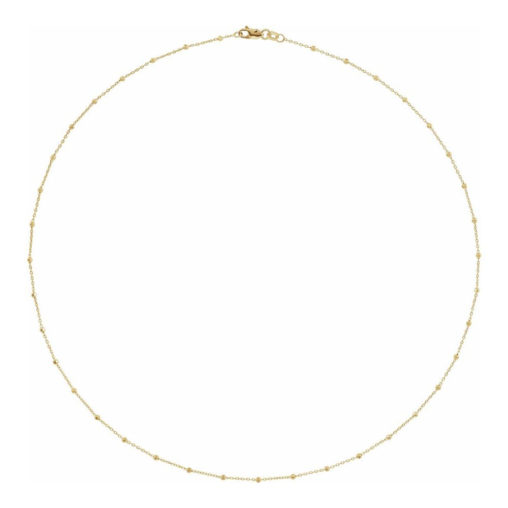 A delicate gold chain necklace with small evenly spaced beads, featuring a clasp at the top.