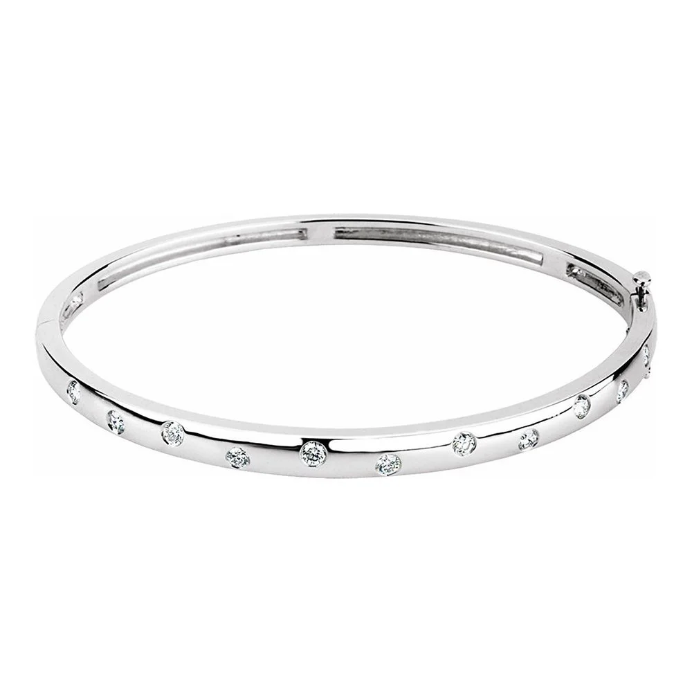 Silver bangle bracelet with evenly spaced small diamonds.