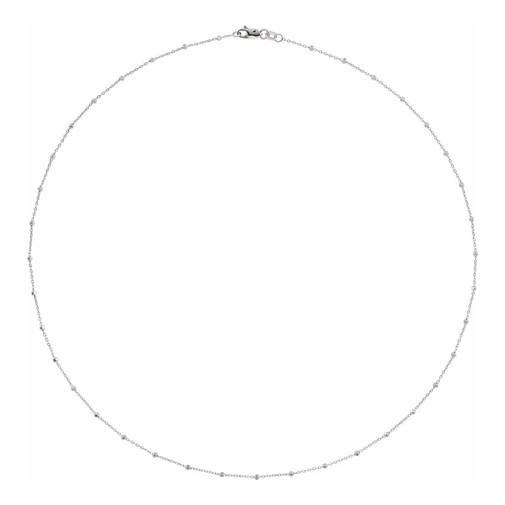Silver necklace with small beads on a thin chain.