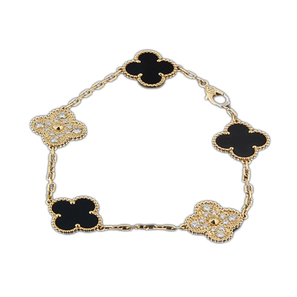 Gold bracelet with alternating black and diamond-encrusted four-leaf clover charms.