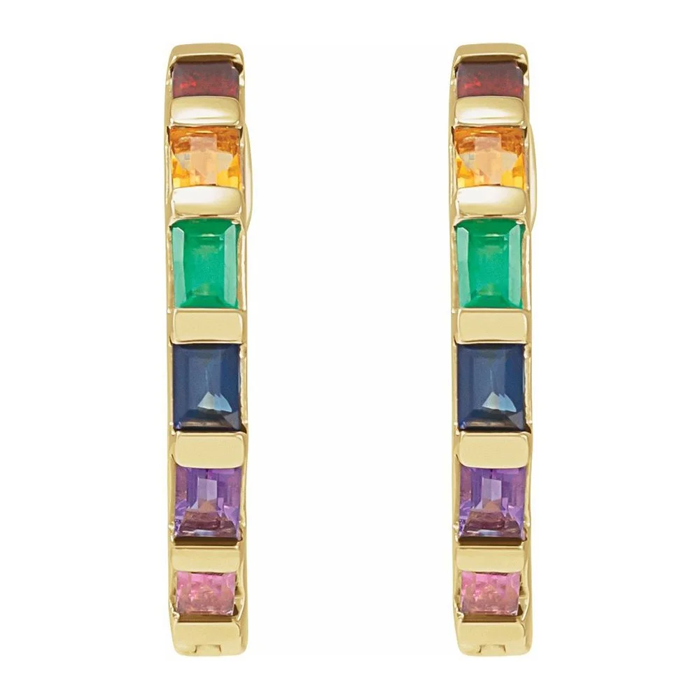 Gold hoop earrings with multicolored gemstones arranged in a rainbow pattern.