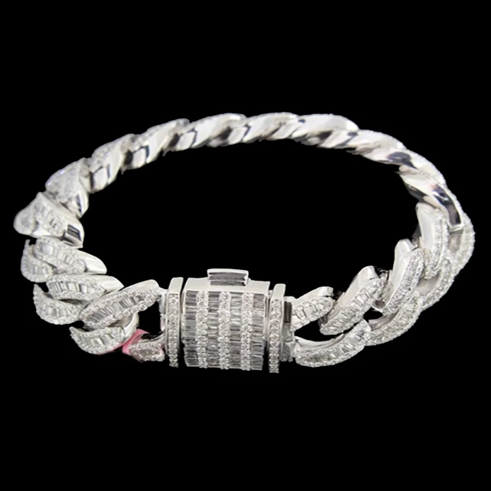 A silver chain bracelet with diamonds and a square clasp on a black background.
