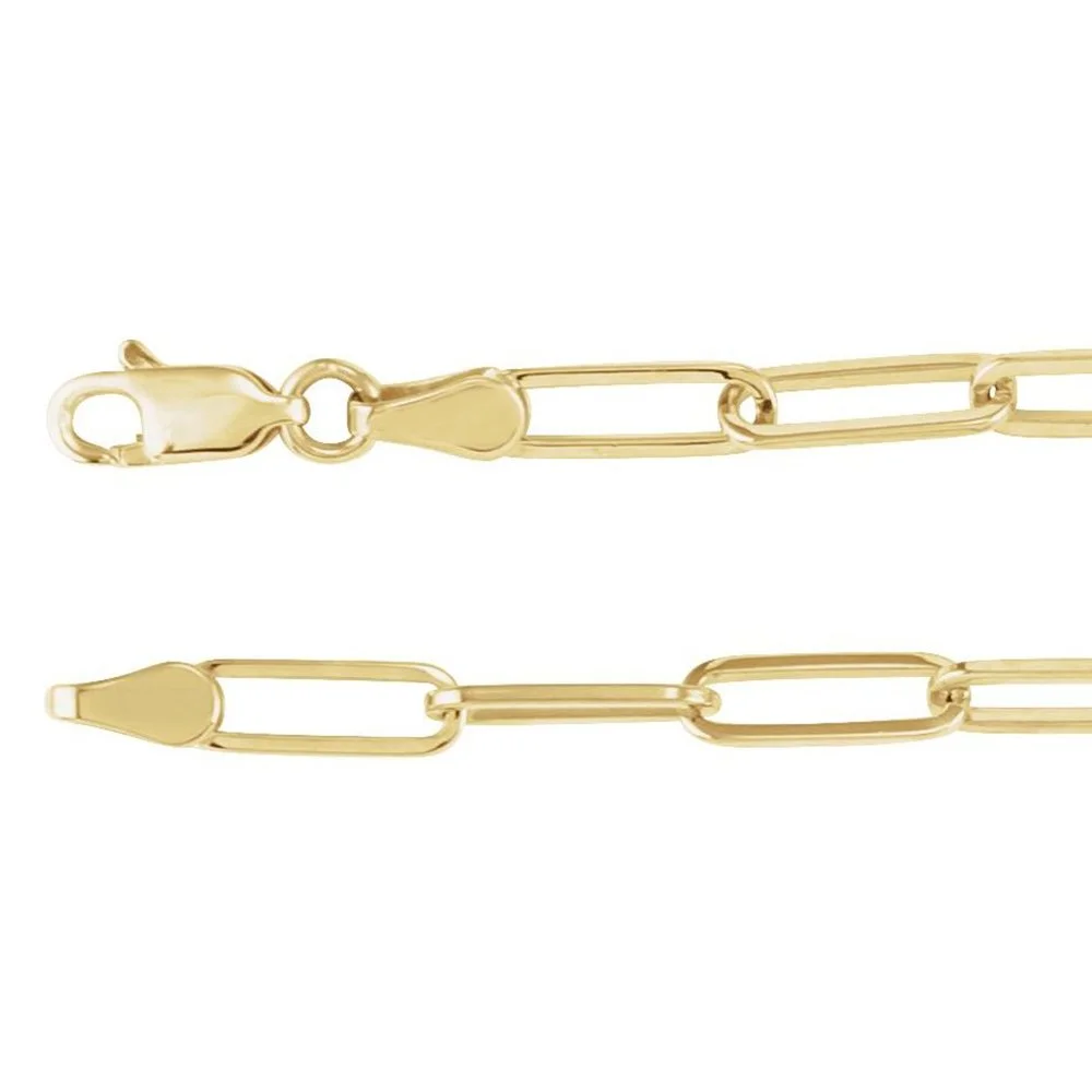 Close-up of a gold chain necklace with a lobster clasp and elongated links.