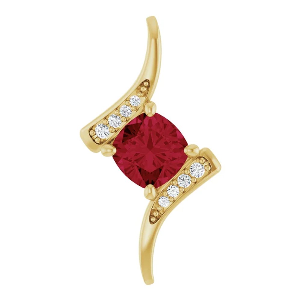 Gold ring with a large red gemstone and small white diamonds.