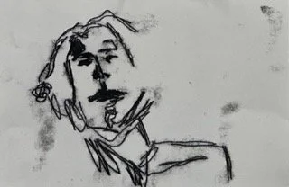 A minimal line drawing of a person's face and shoulders.