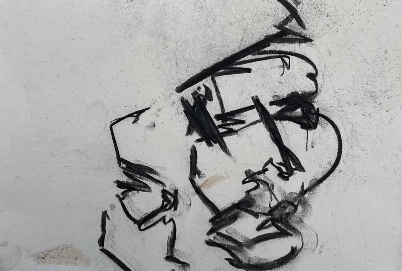 Black and white abstract sketch of a face and hand on a textured paper background.