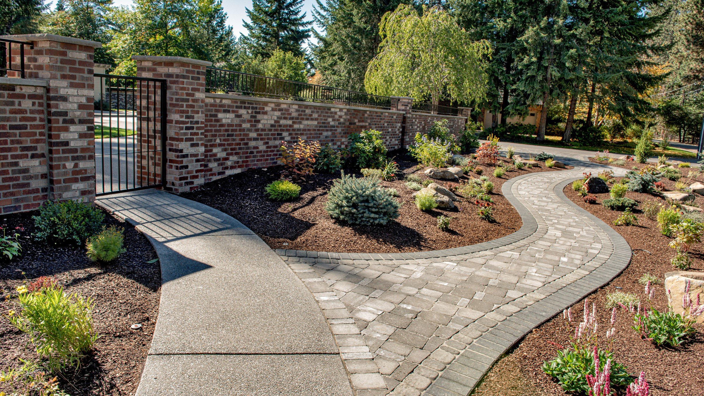 mm-concrete-paver-walkway-fronting-a-brick-fence-16x9-1.jpg