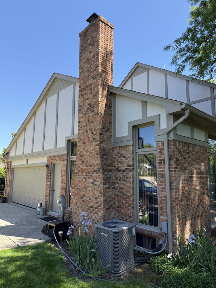 Troy home with painted stucco and wood trim