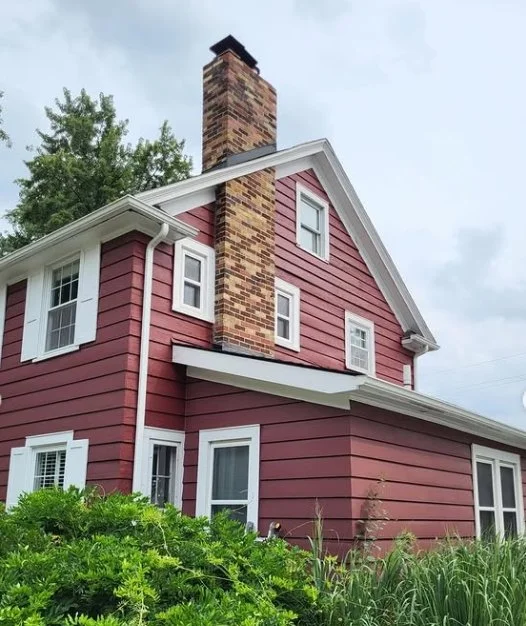 Birmingham home with red wood siding and white trim, repainted