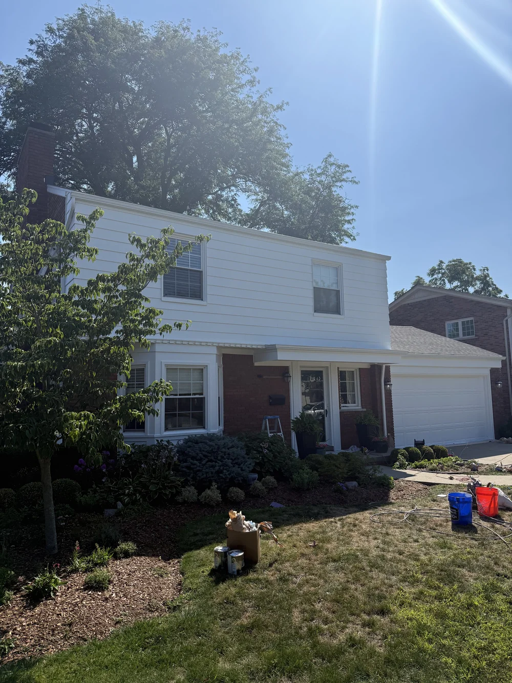 Grosse Pointe Woods home with white aluminum siding, repainted