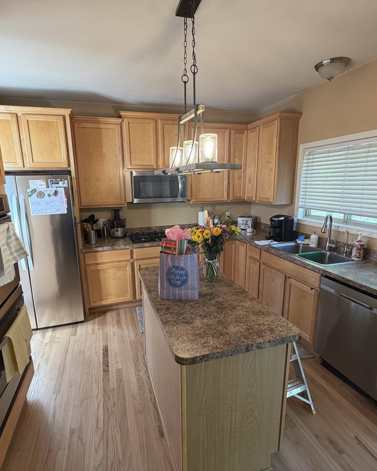 Kitchen cabinets before painting, honey oak cabinets and island, White Lake MI