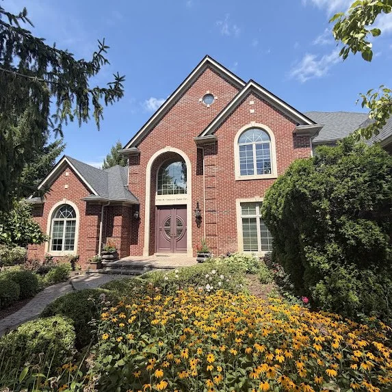 Rochester Hills brick home with freshly painted trim