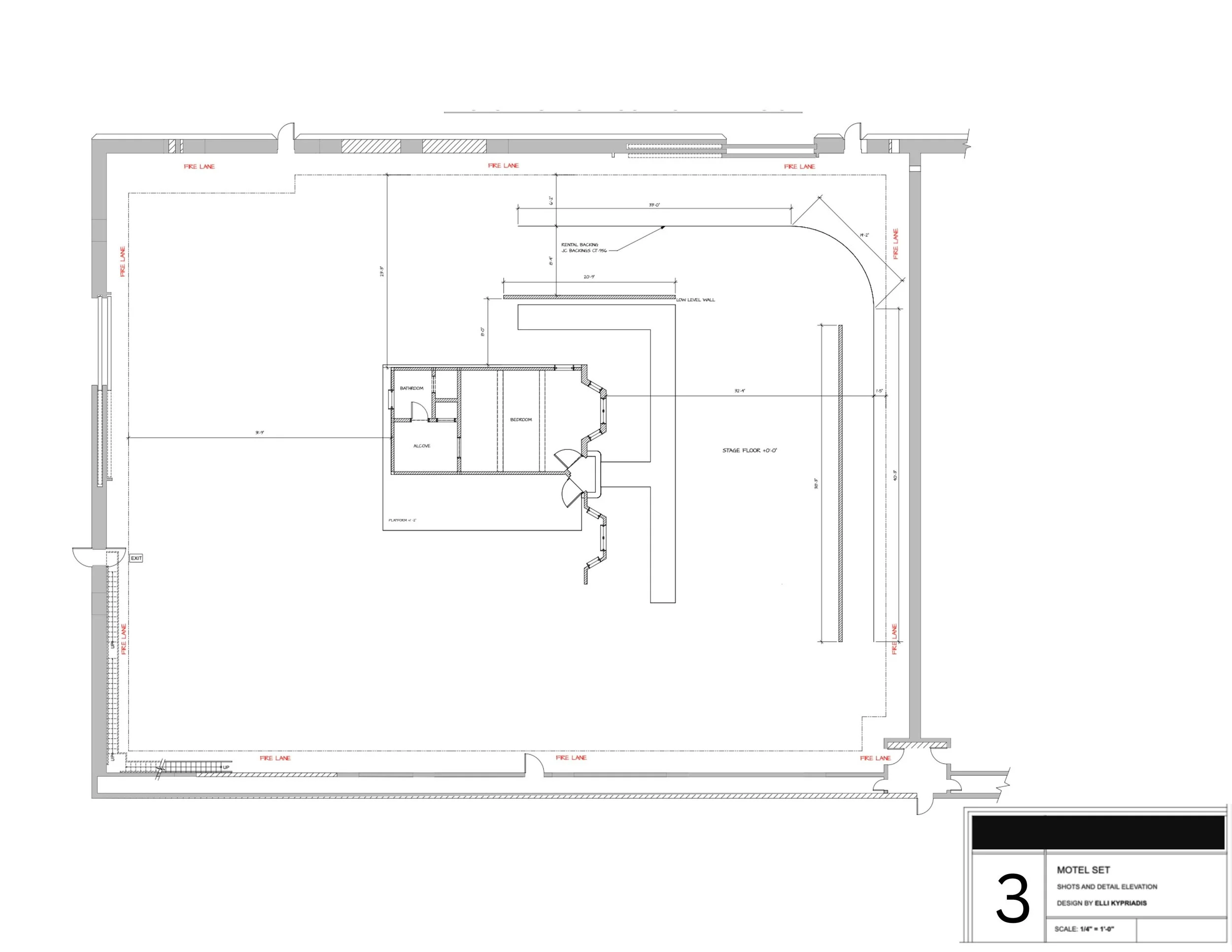 Floor plan of a motel set design with rooms, stage area, and fire lanes marked around the perimeter.