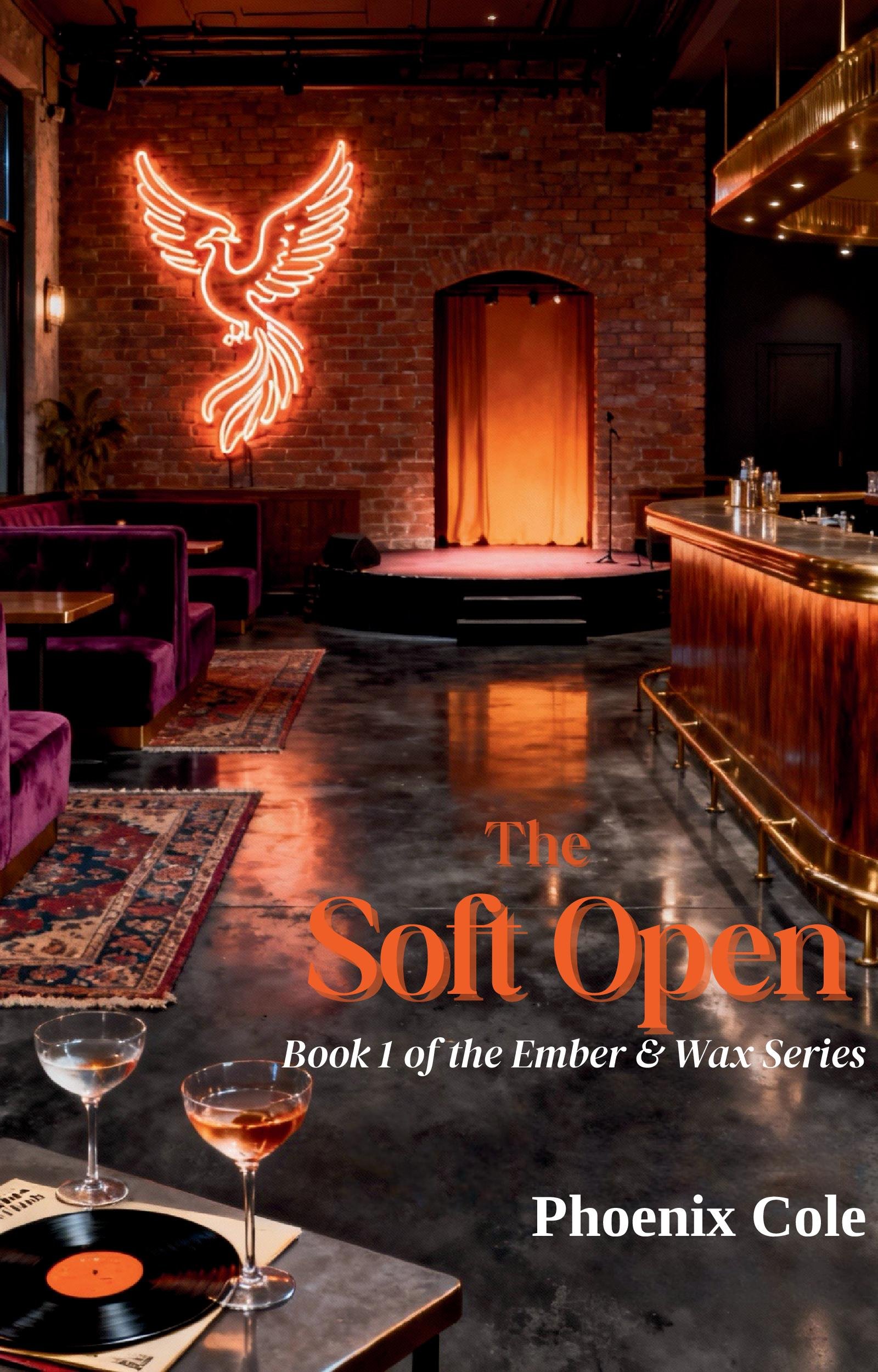 Cover of a book titled "The Soft Open" by Phoenix Cole. The background features an interior of a cozy, stylish bar or performance space with a brick wall, a neon winged phoenix sign, a small stage with a curtain, plush purple seating, a patterned rug, and a bar with glasses and bottles. There is also a record and two glasses of wine or cocktails on a table in the foreground.