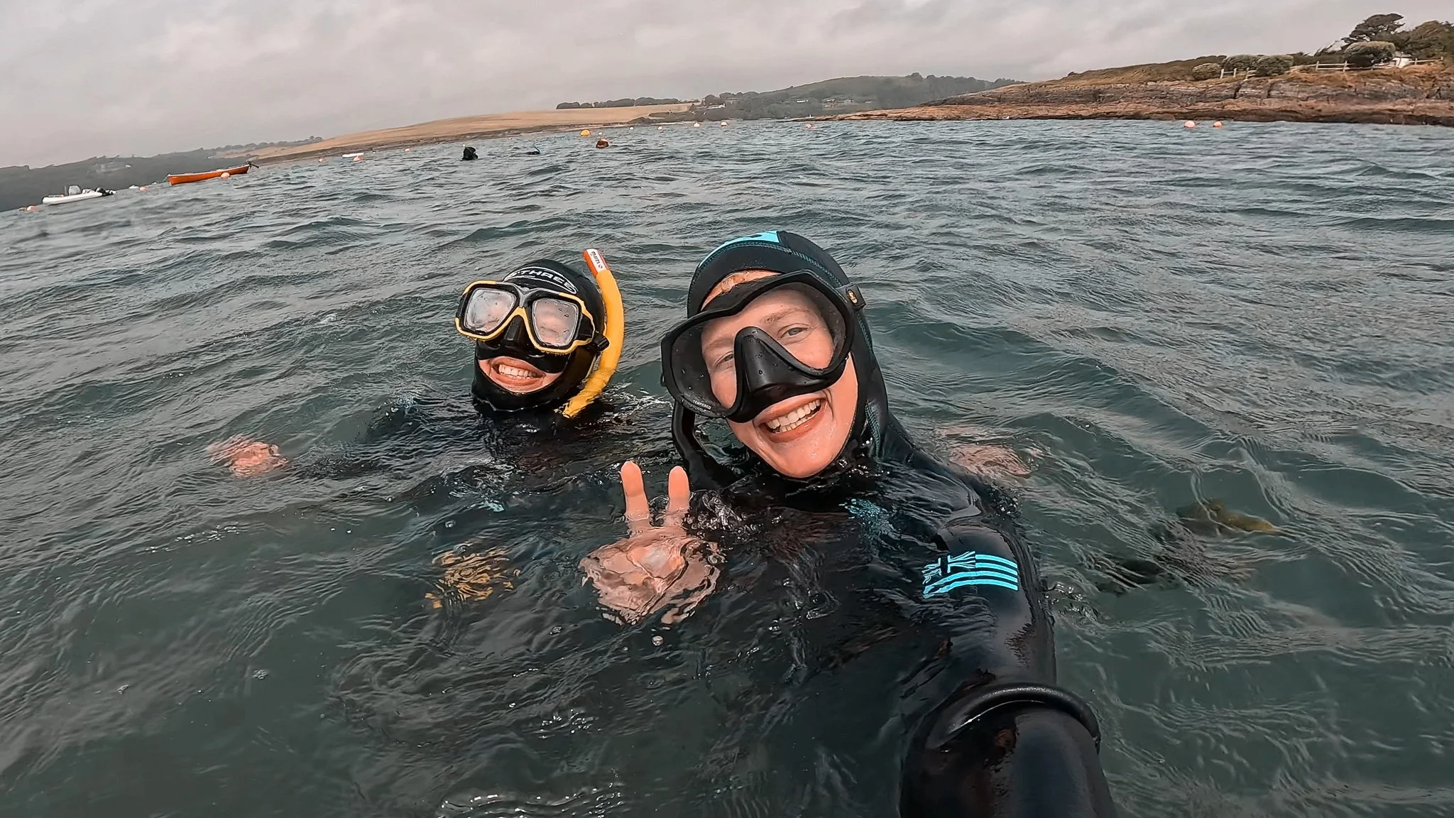 2 smiling people snorkelling in Cork