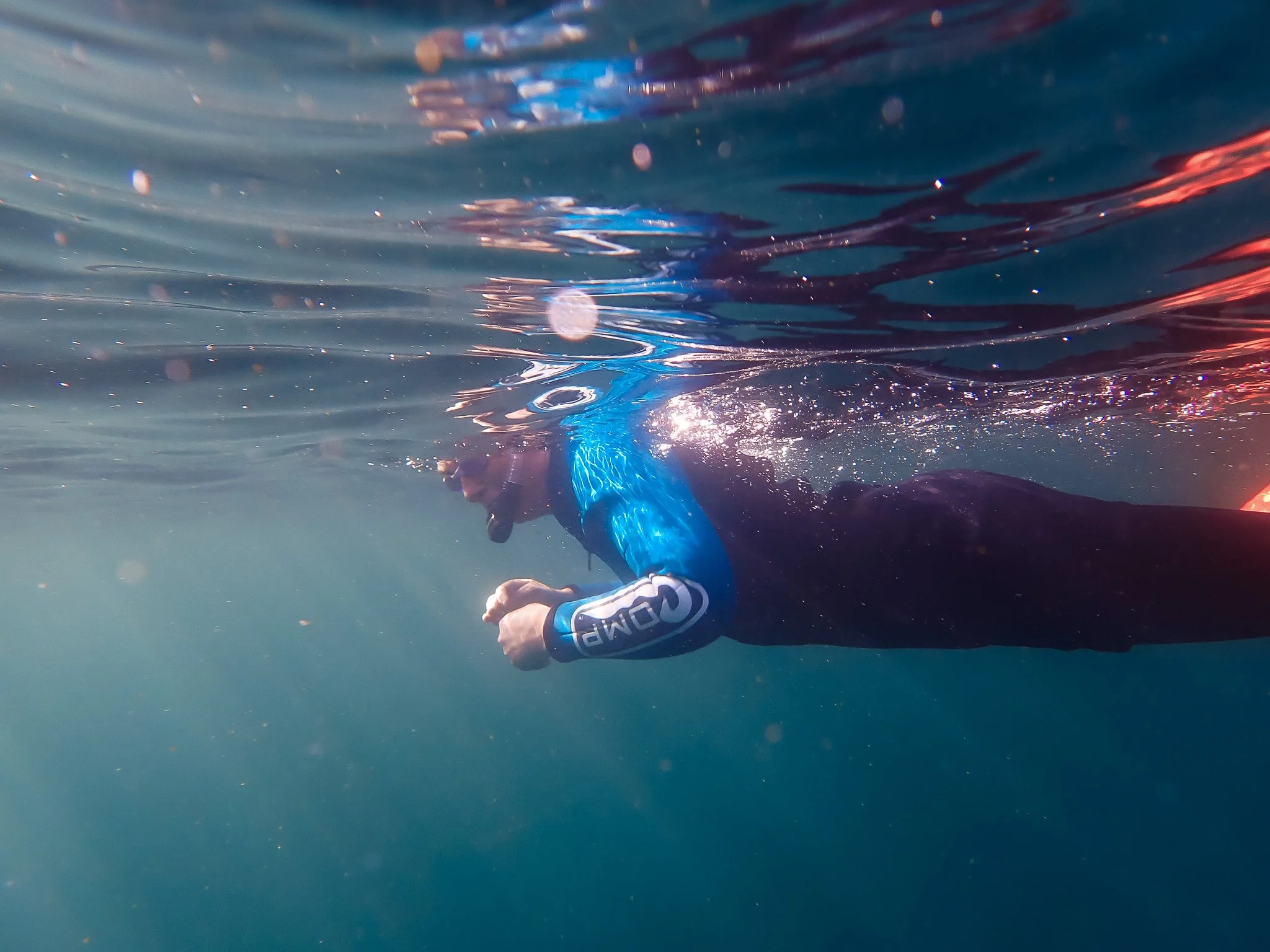 A woman snorkelling in Cork in the sea
