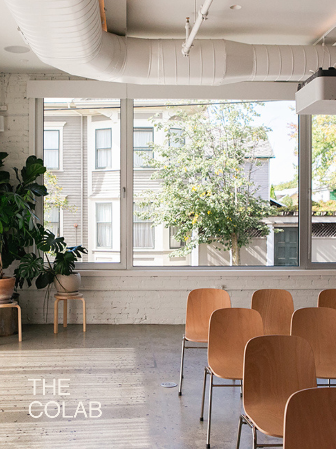 The Spark of Hudson Coworking space with chairs and plants