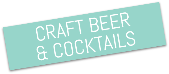 A sign with a teal background and white text that reads "Craft Beer & Cocktails".
