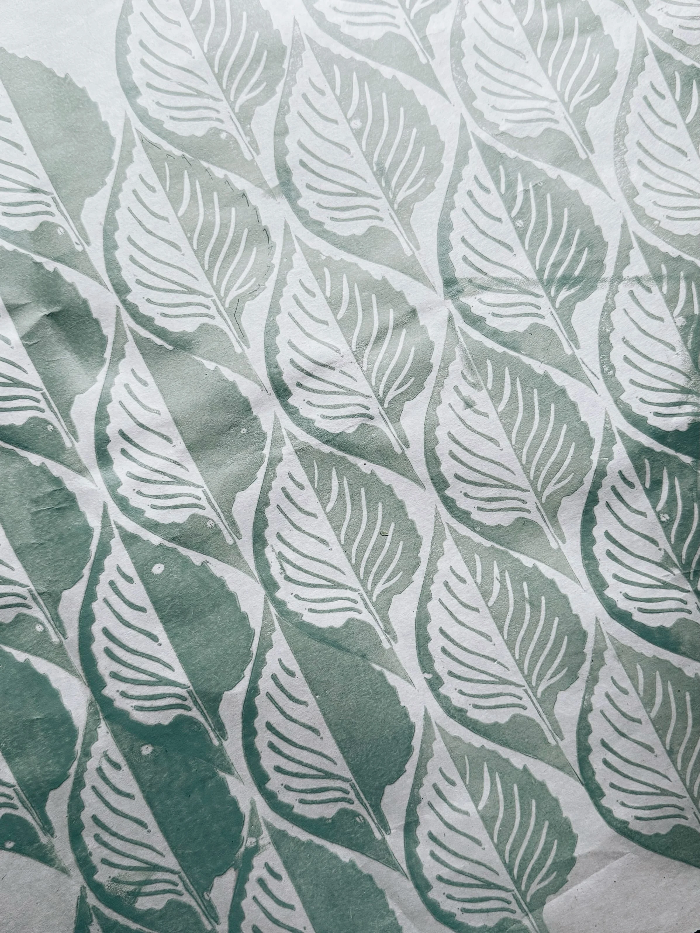 Perilla leaf, still in progress. 

Working through a new repeat. Print, carve, print again. I have to remind myself not to rush this in-between stage.