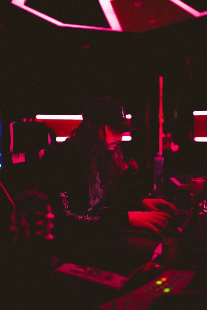 Spock working in the studio with moody red lighting