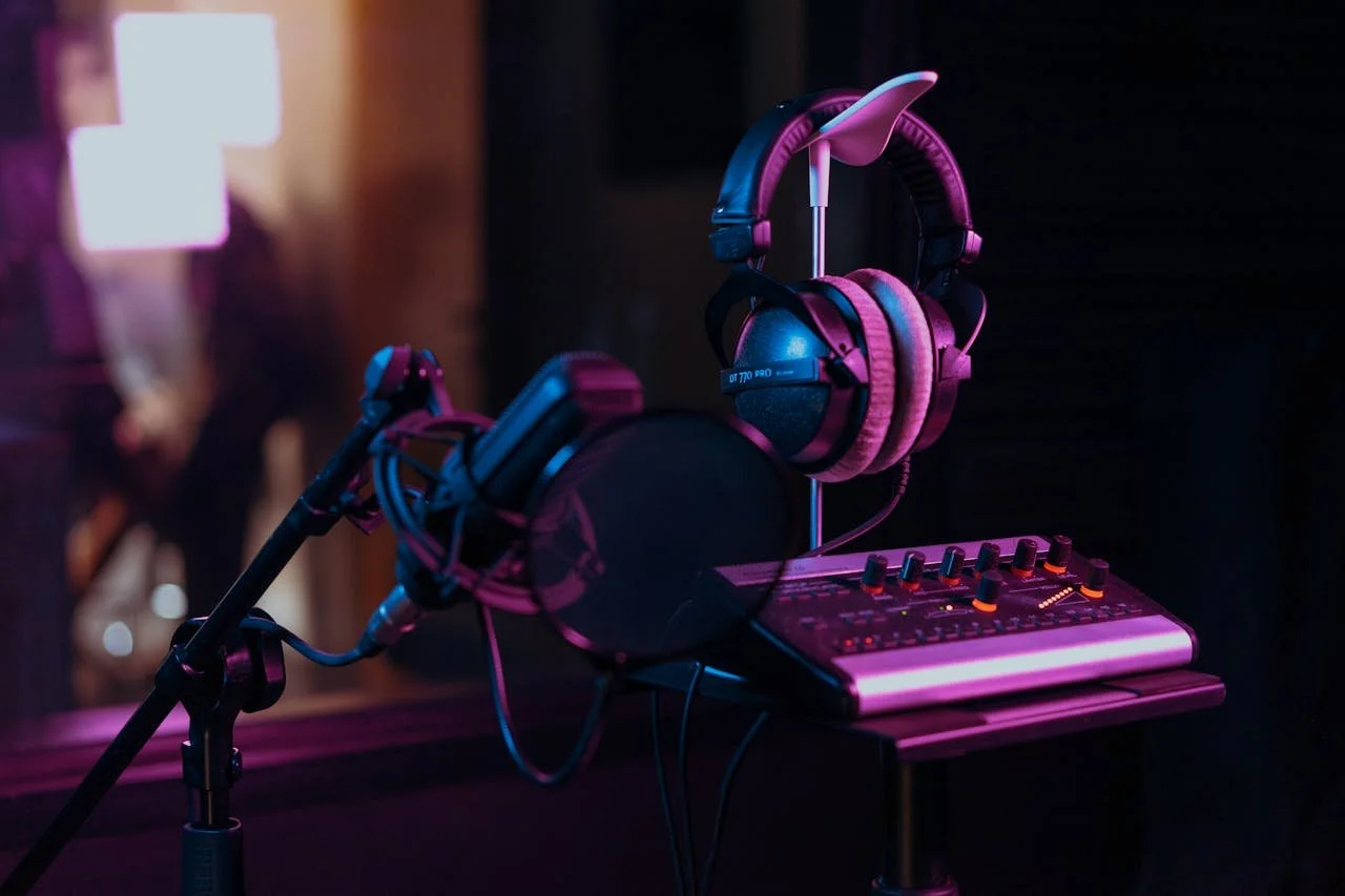 close up of microphone and headphones in music studio