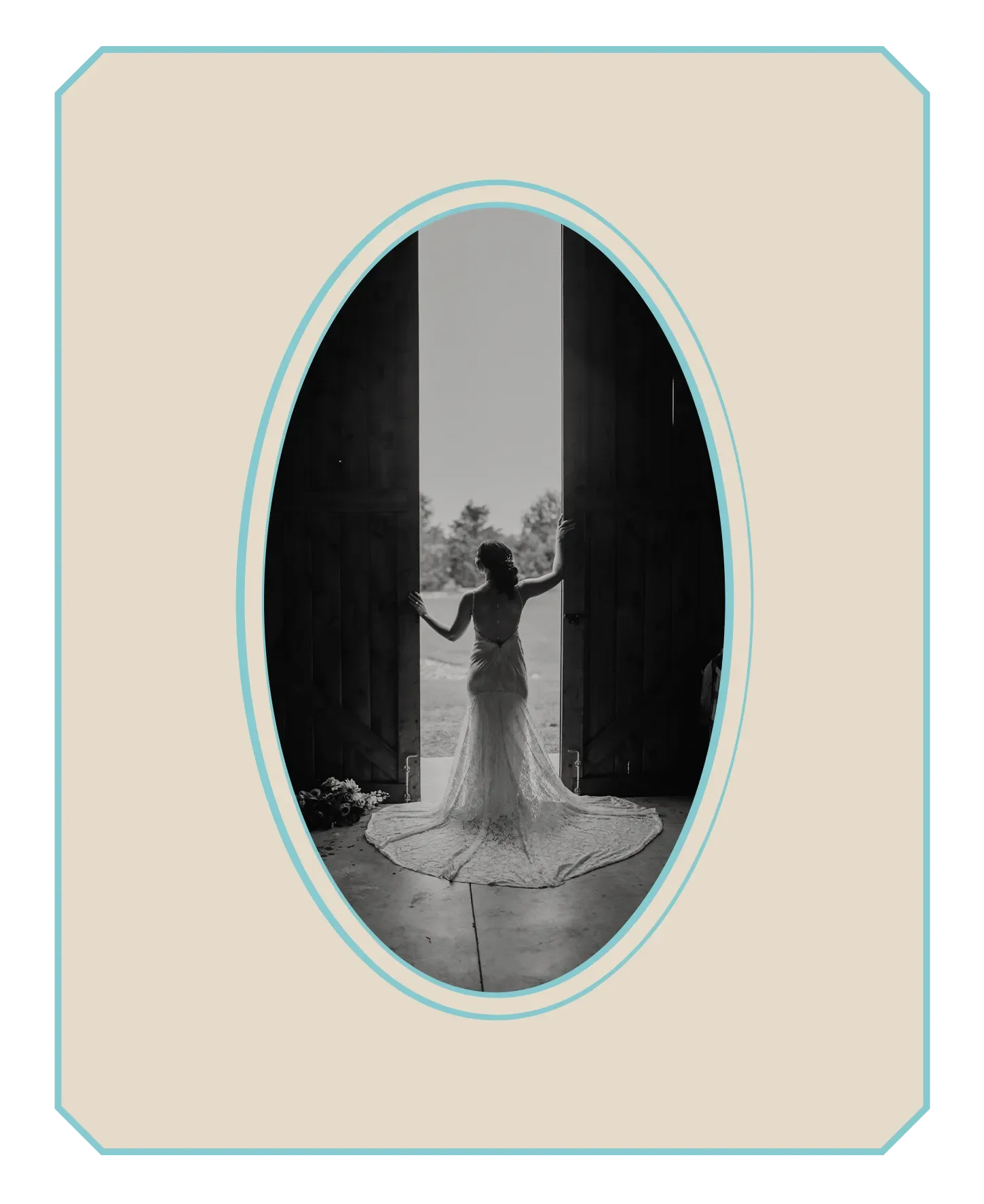 A bride in a lace wedding gown stands in the doorway of a tall barn door, silhouetted against the outdoors in black and white.