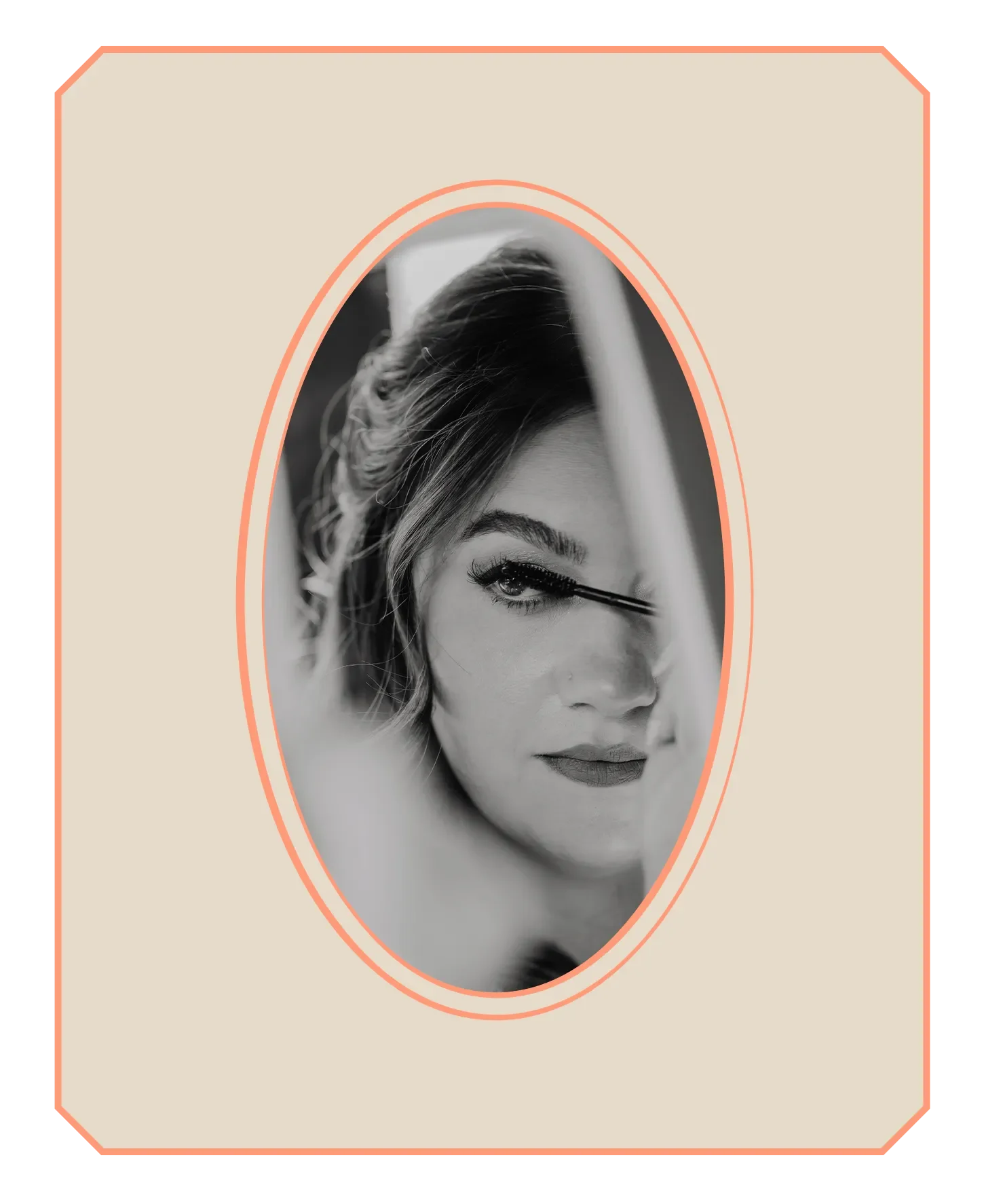 A bride with perfectly styled hair applying mascara to her eyelashes in front of a mirror, the color is striking black-and-white.