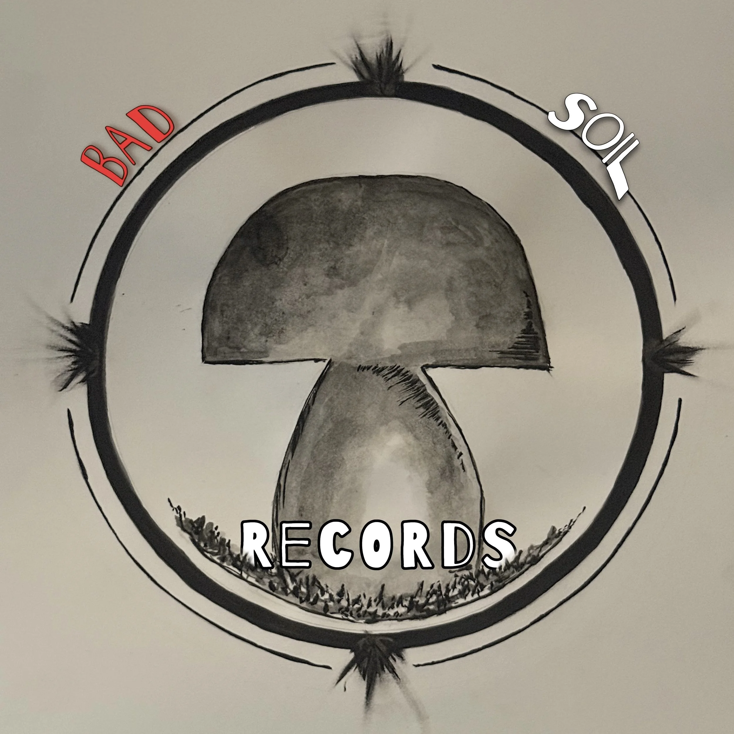 A circular logo with a mushroom illustration inside, with the words "BAD" in red on the left, "SOIL" in white on the right, and "RECORDS" in white at the bottom surrounding the mushroom.