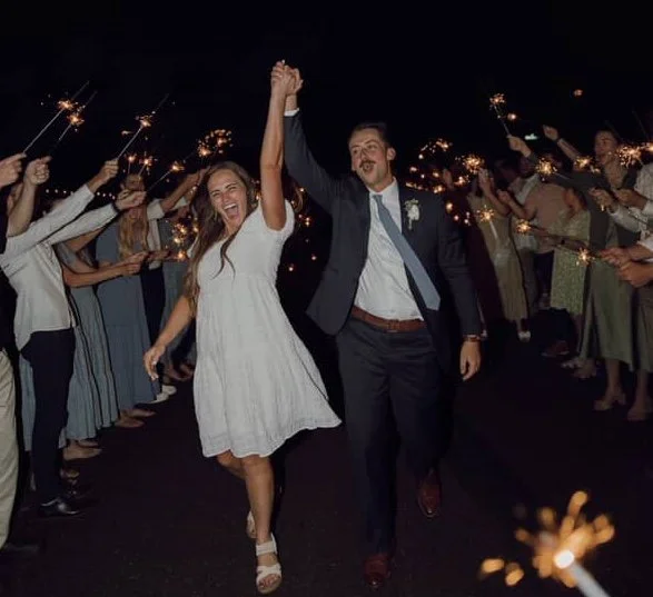 couple holding hands and walking