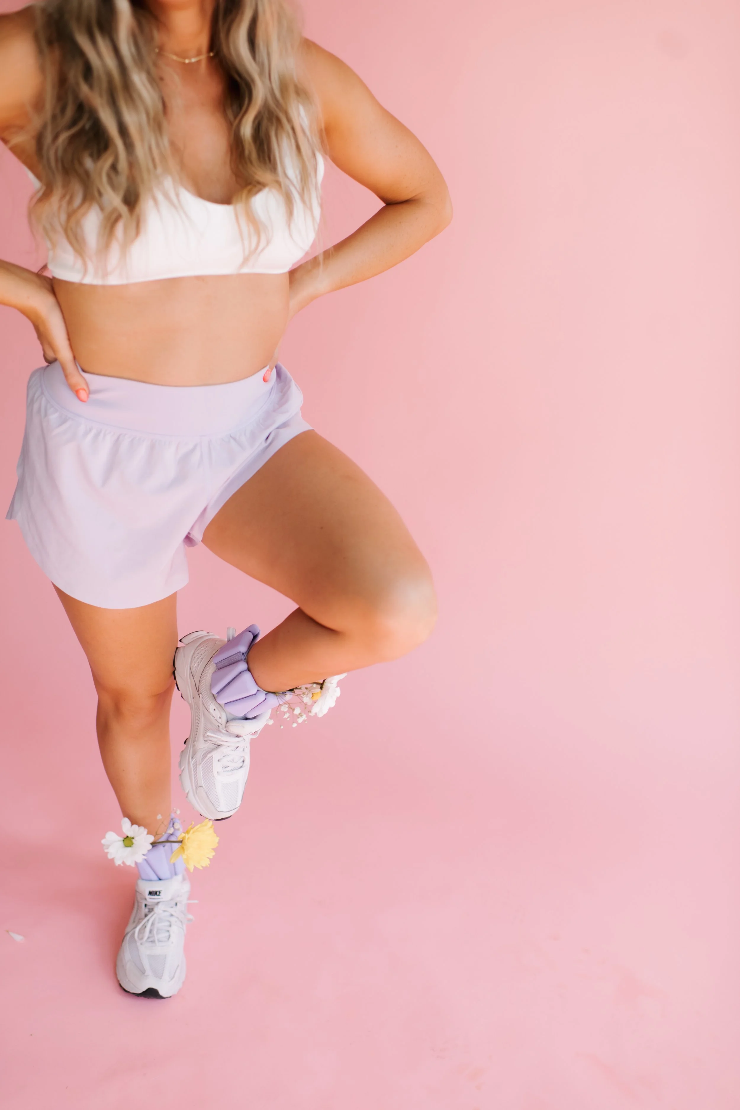 Tanned woman with her leg hiked up