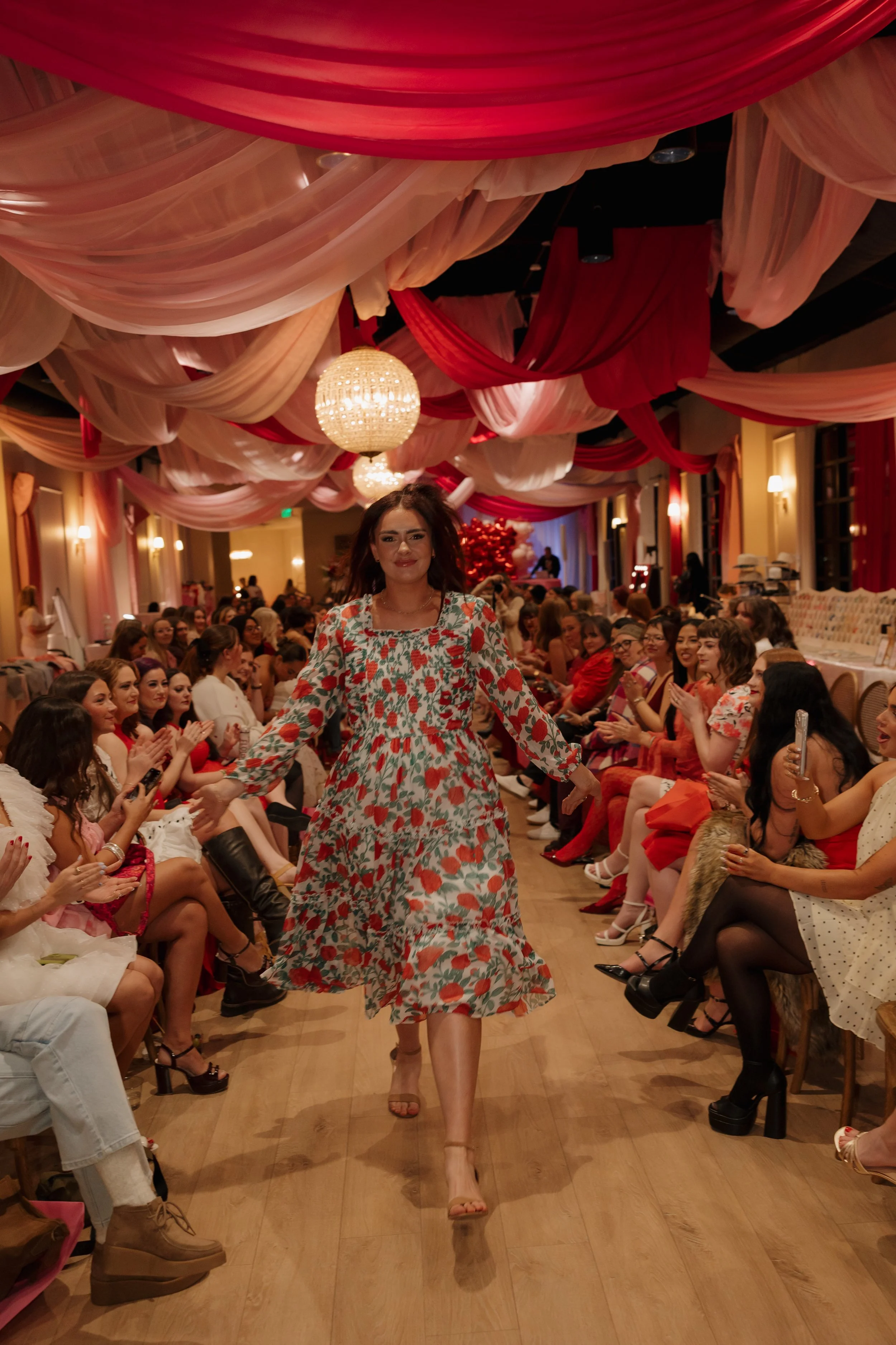 Woman showing off her tan walking down a runway