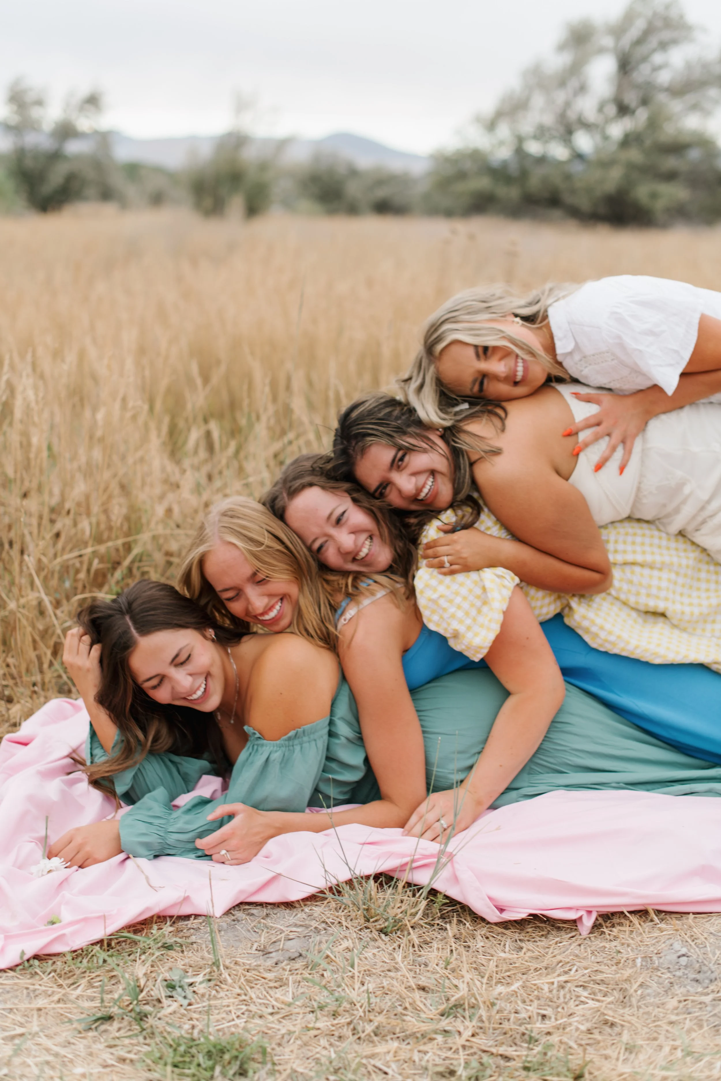 Group of girls lying on top of one another