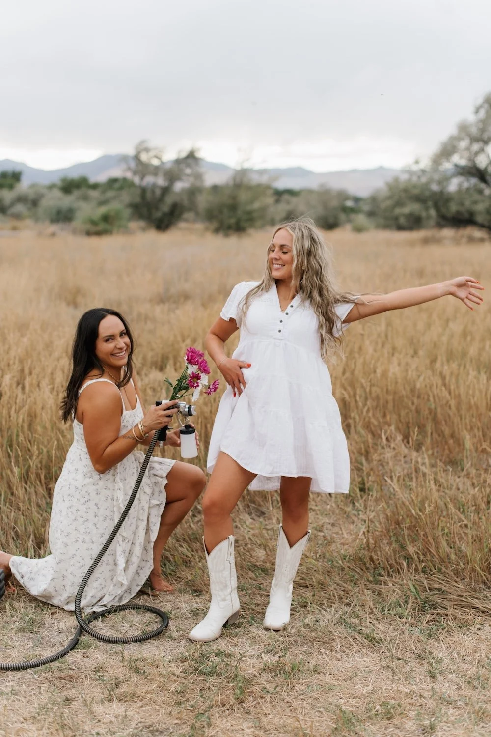 Professional airbrush artist spray tanning a client