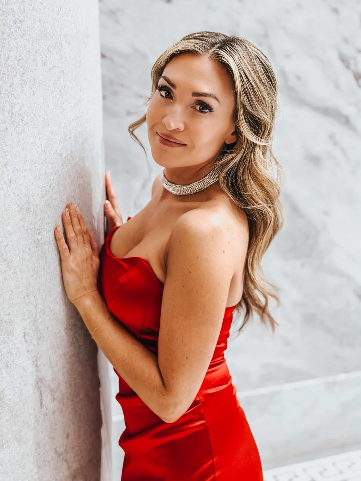 Tanned woman in a red dress