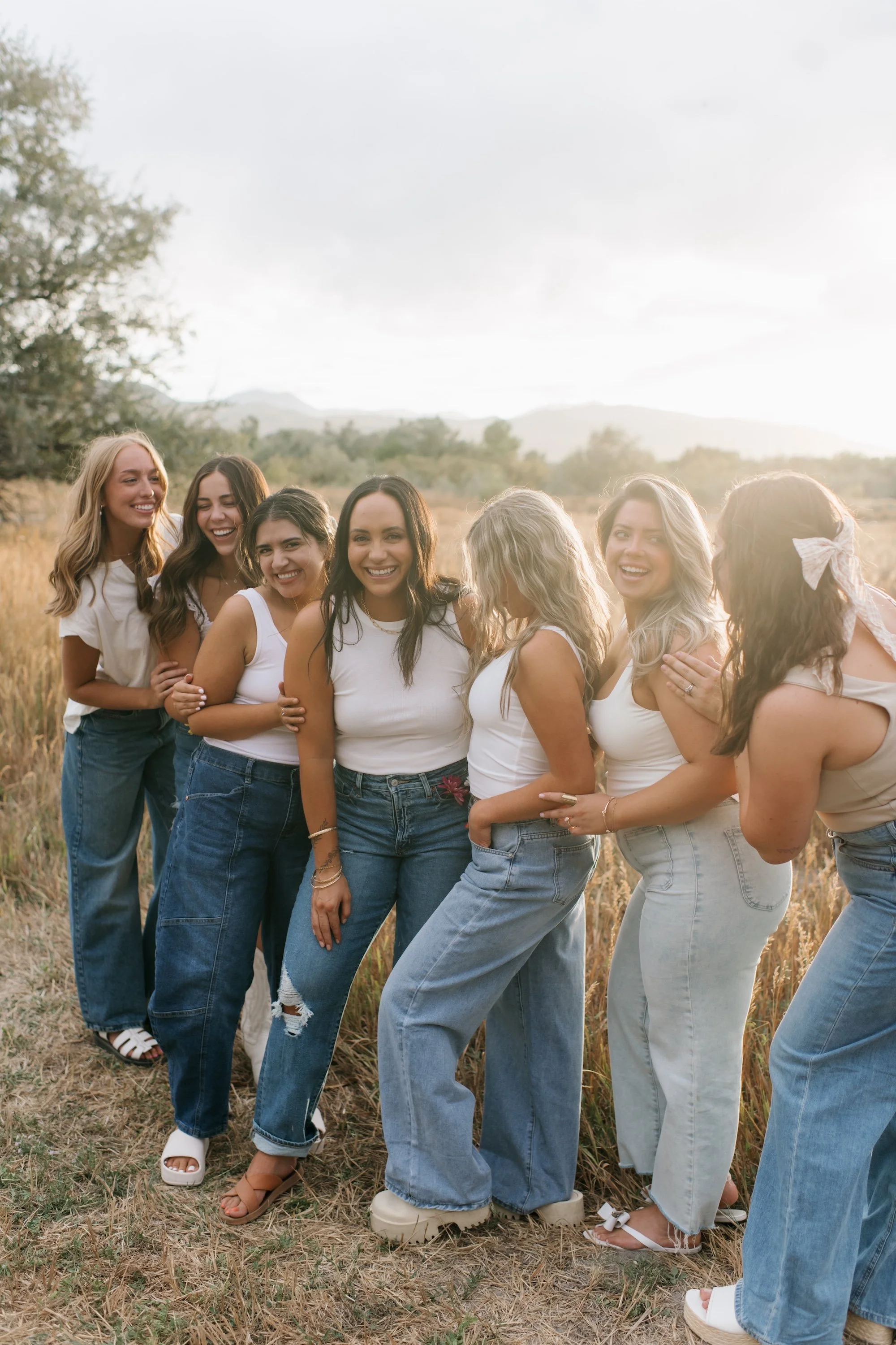 Group of tanned women smiling and laughing