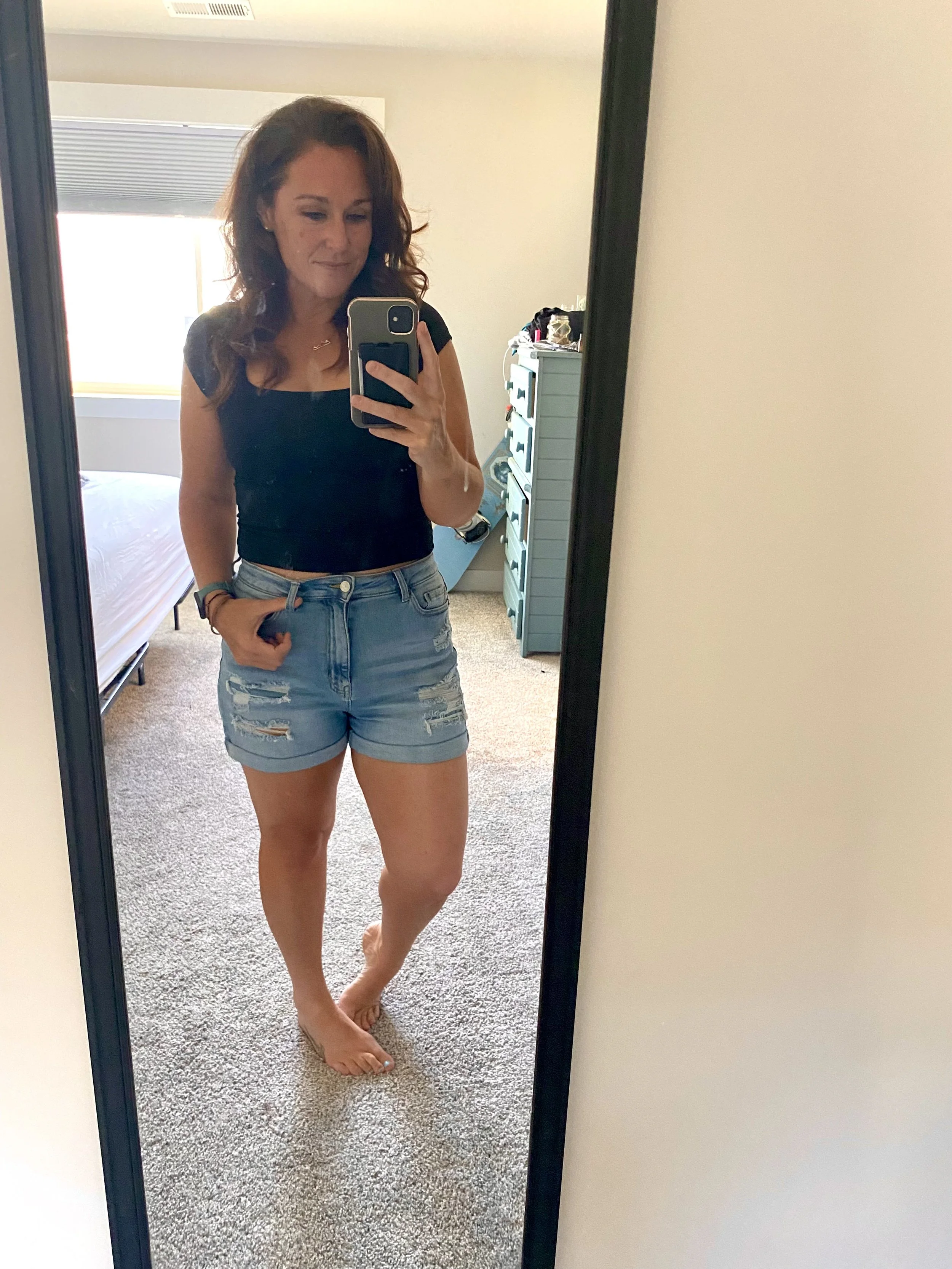 Woman taking a mirror selfie