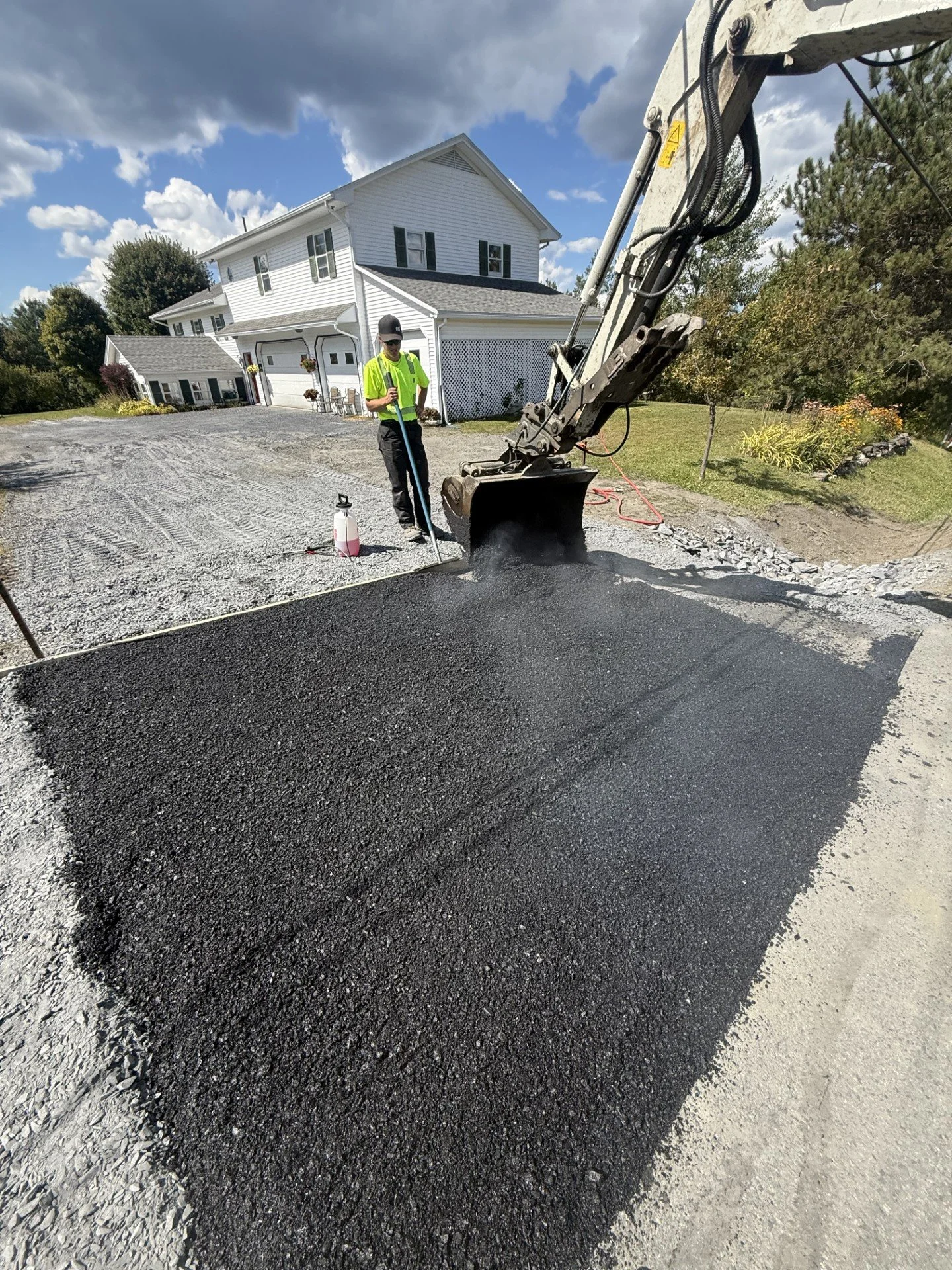 A culvert replacement, grading, and asphalt apron project completed in Graniteville, VT