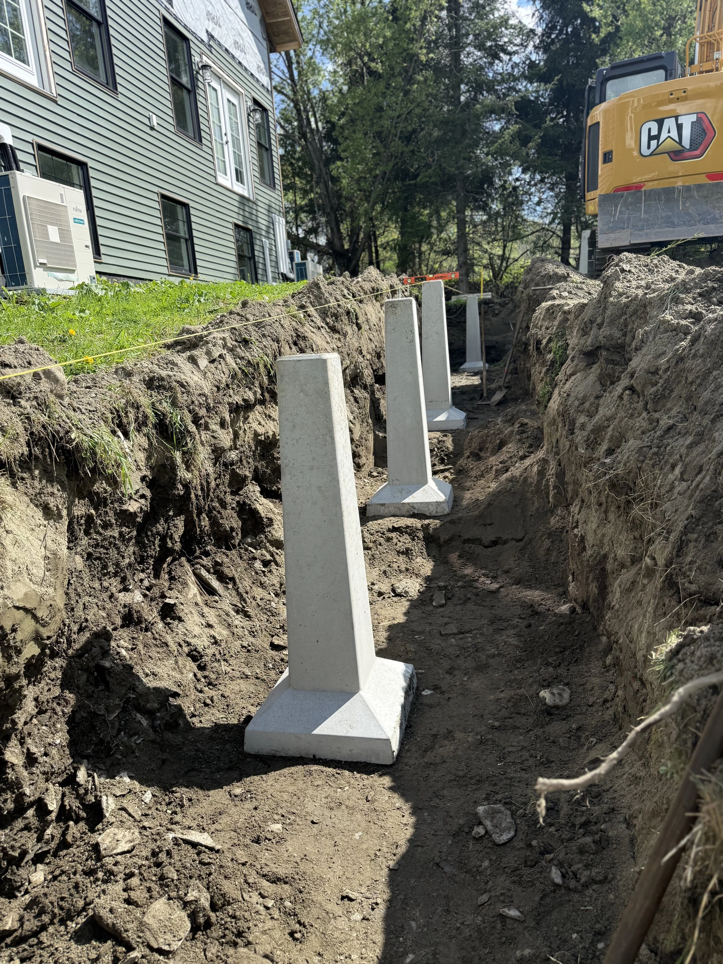 Precast concrete piers for a deck to be constructed on in Plainfield, VT