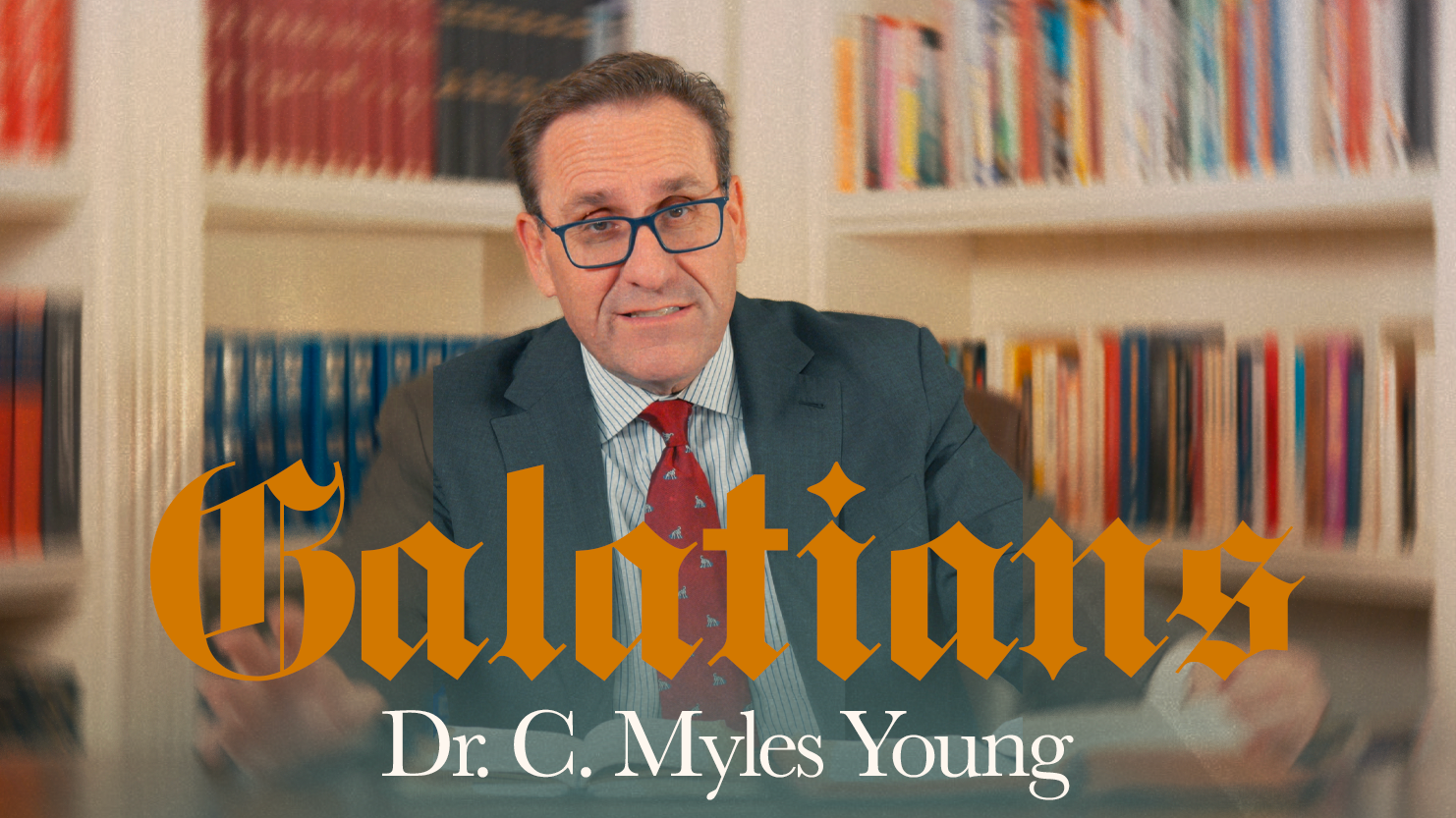 A man wearing a suit and tie, with glasses, sitting in front of bookshelves filled with books, with the word "Galatians" written across the image and "Dr. C. Myles Young" below.