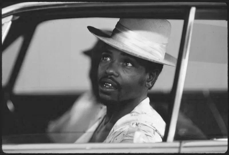 Green Book For Motorists, vintage image of Black motorist looking out car window