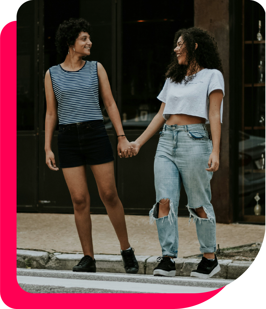 Photo: Caco Andrade; Two Black Women Laughing and Holding Hands, Green Book For Health Black Womens Healthcare
