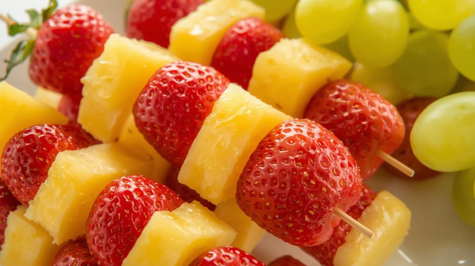 fruit skewers with strawberries, pineapple, and grapes.jpg