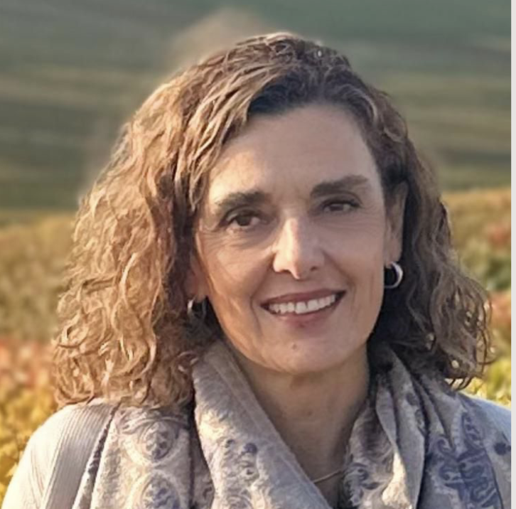 Bety Lagos is the FAME women's pastor at Carmel Church in San Diego. She helps women grow in confidence, learn to pray, and make lifelong Christian friends. A woman smiling outdoors, wearing sunglasses and a blue jacket.