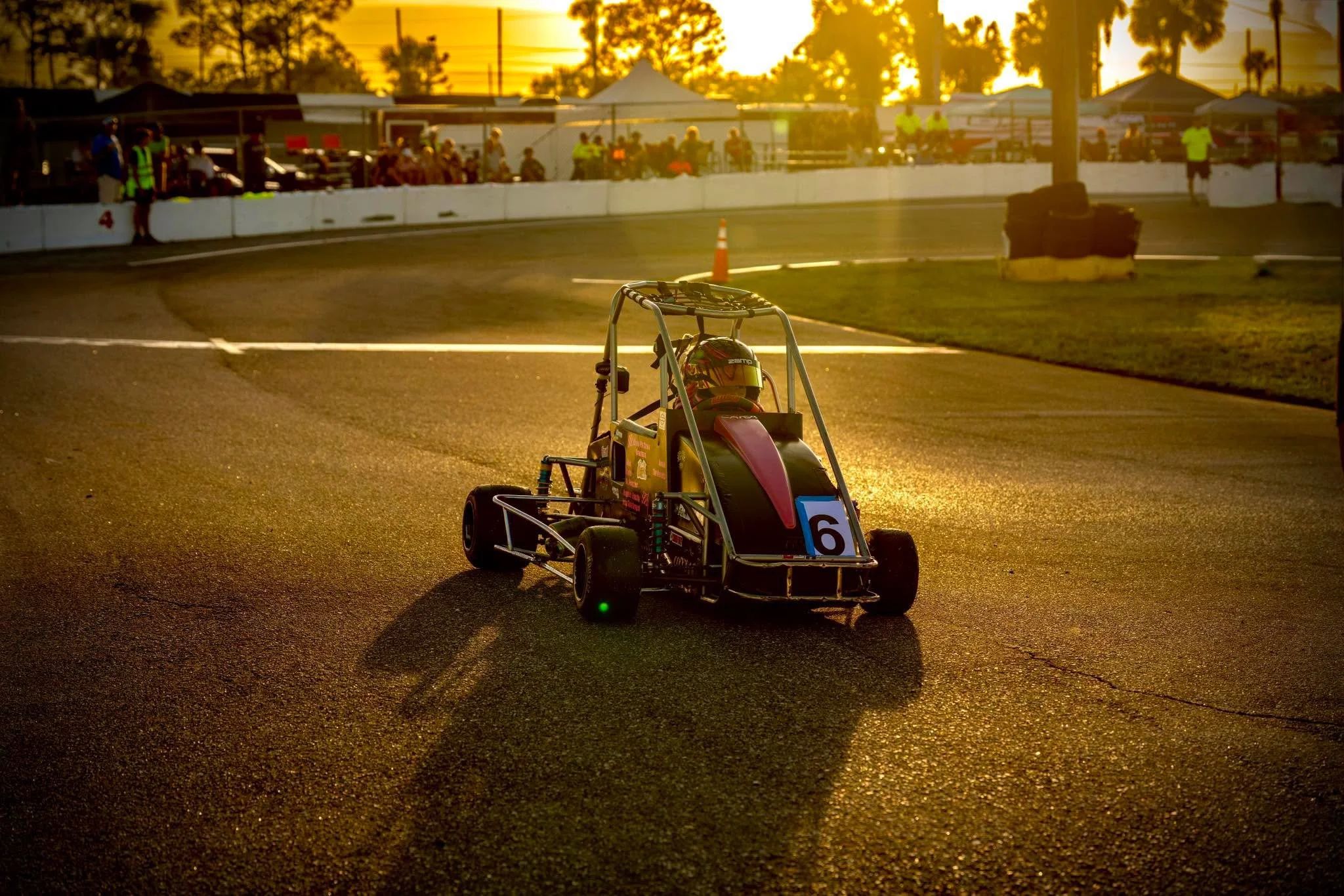 Cara Madison Racing the No. 9 quarter midget during an evening race.