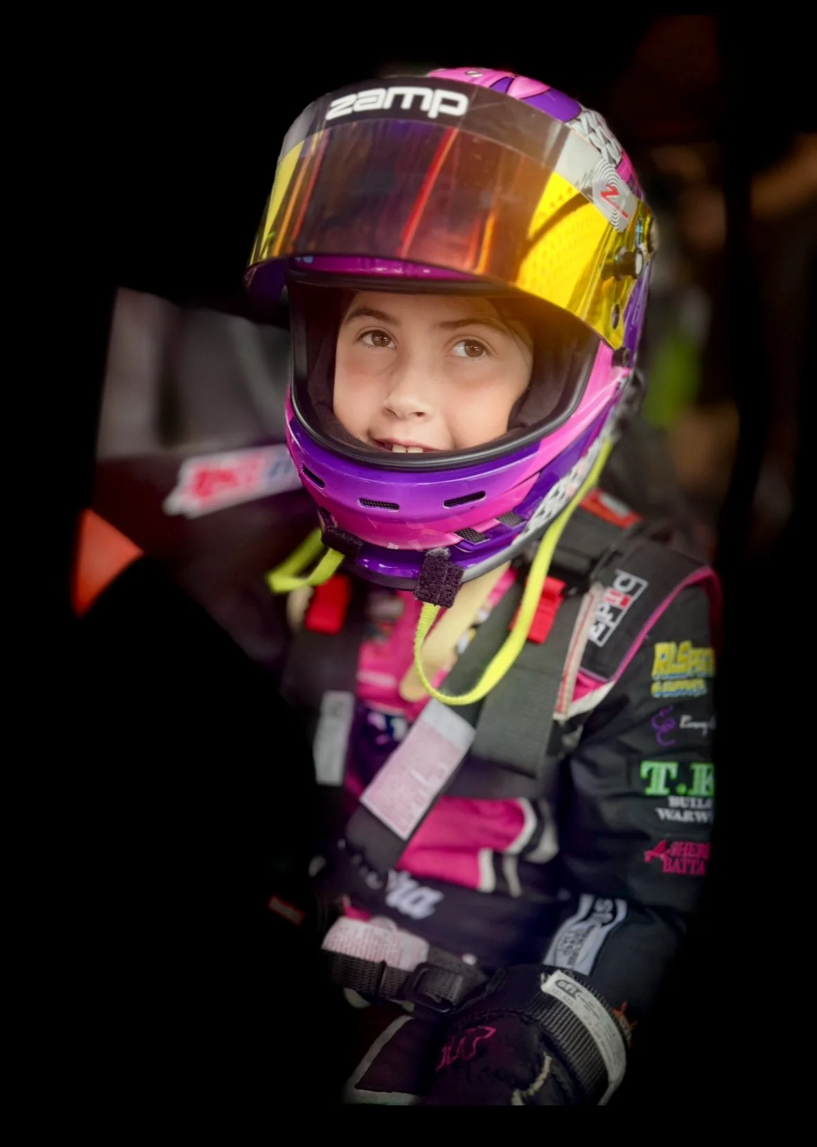 Cara in race car in race suit