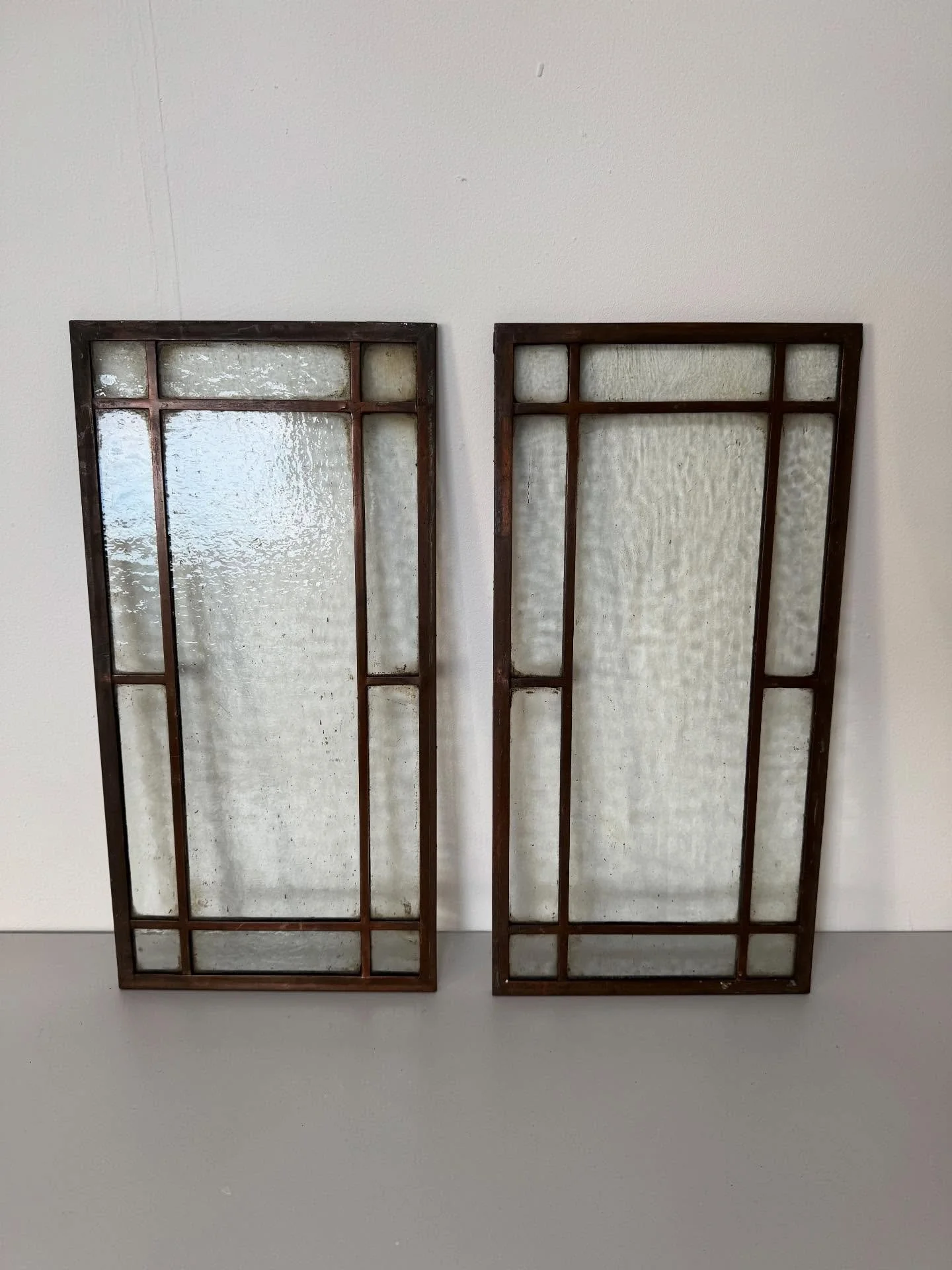 Pair of reclaimed, diminutive and perfectly formed cathedral glass windows set in copper frames. Carefully removed and ready for their next life. Not dated but a lovely patina so they clear have some age. No cracks or damage to glass or frames. Can p
