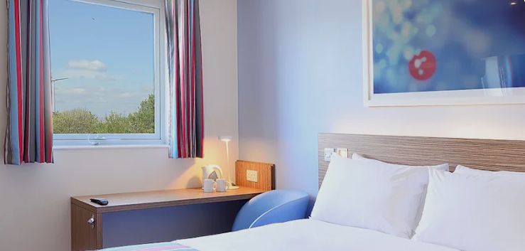 A Travelodge hotel room in a UK coastal town.